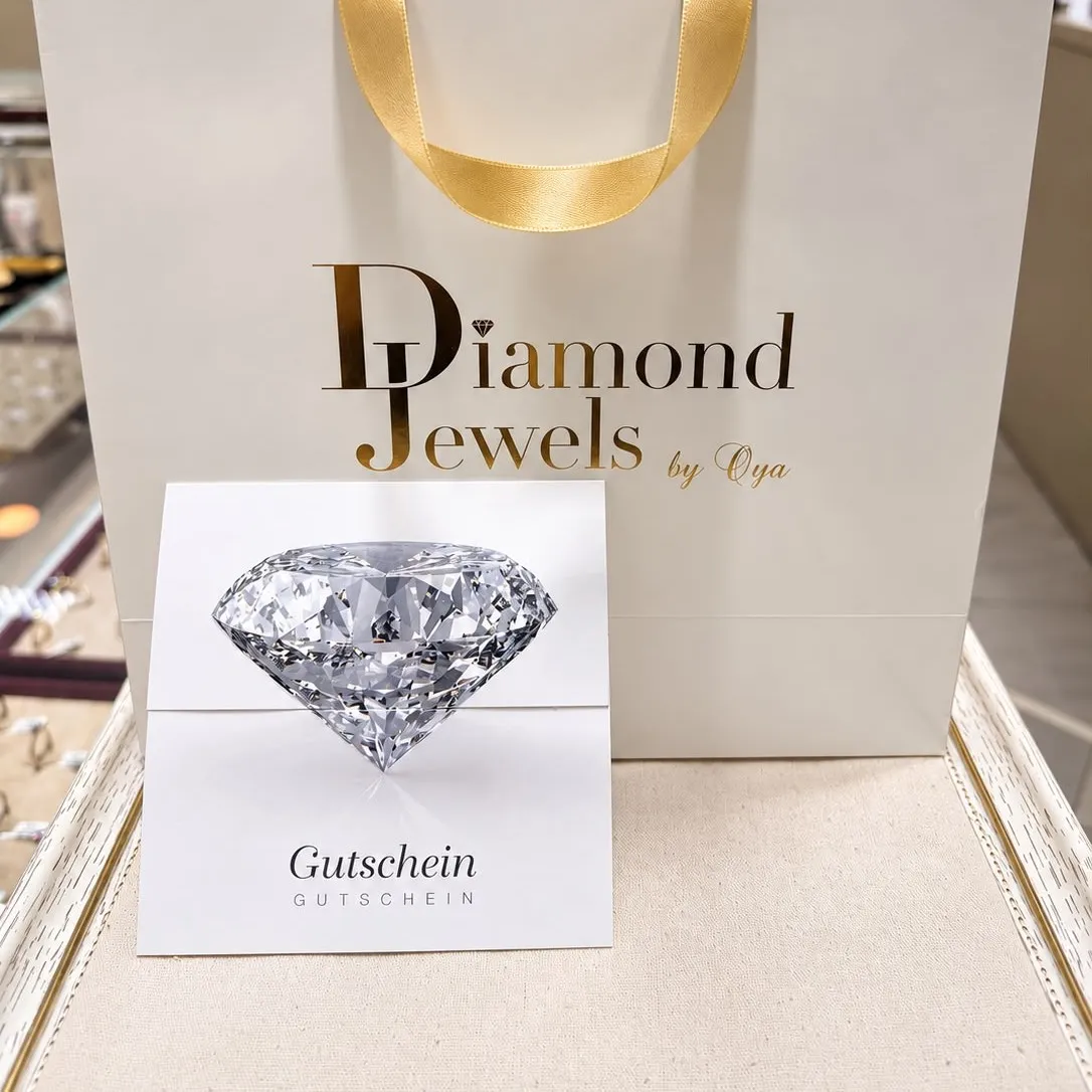 Diamond-Jewels-Geschenktüte mit goldenem Band und einem Gutschein mit Diamantmotiv